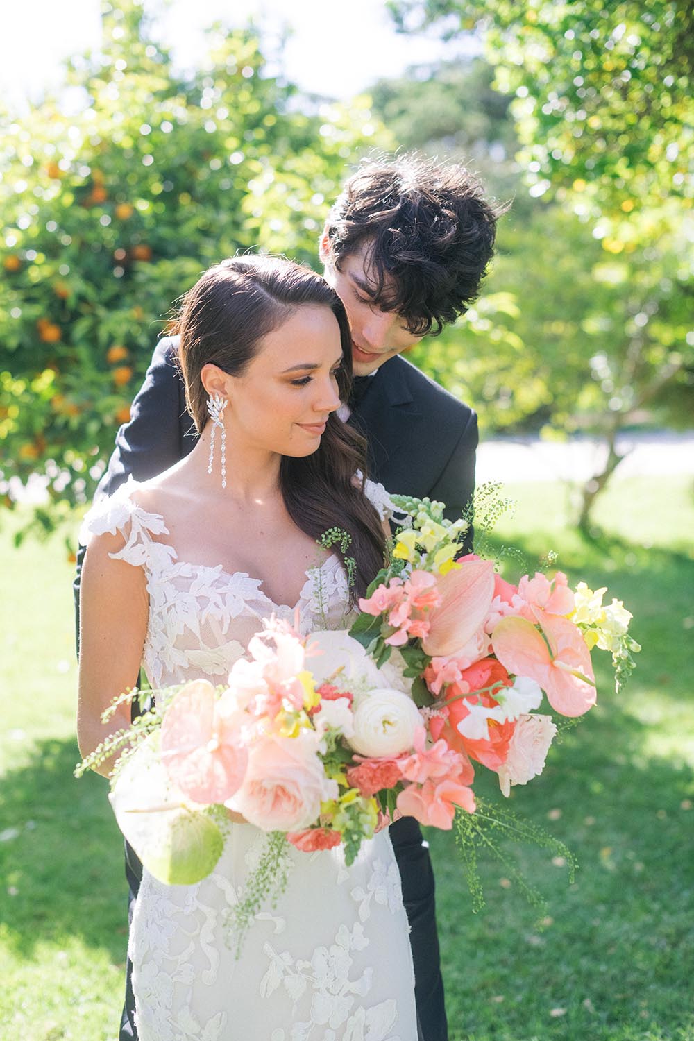 bride and groom smile